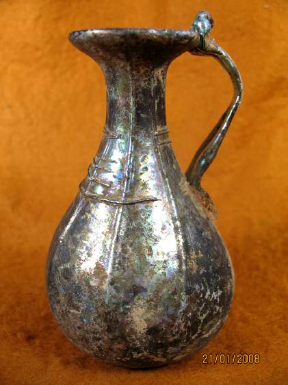 **SOLD** A really lovely Roman glass pitcher with multi coloured iridescense