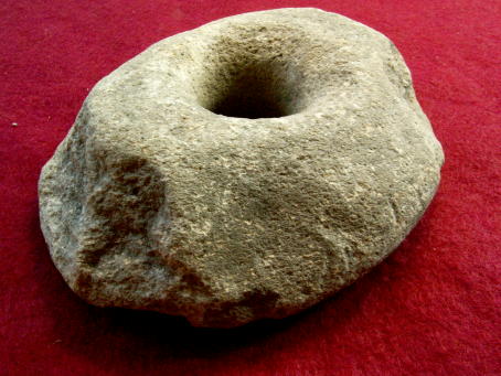 M395. **SOLD**An unusually large stone spindle whorl ex Banningham Old Rectory Collection